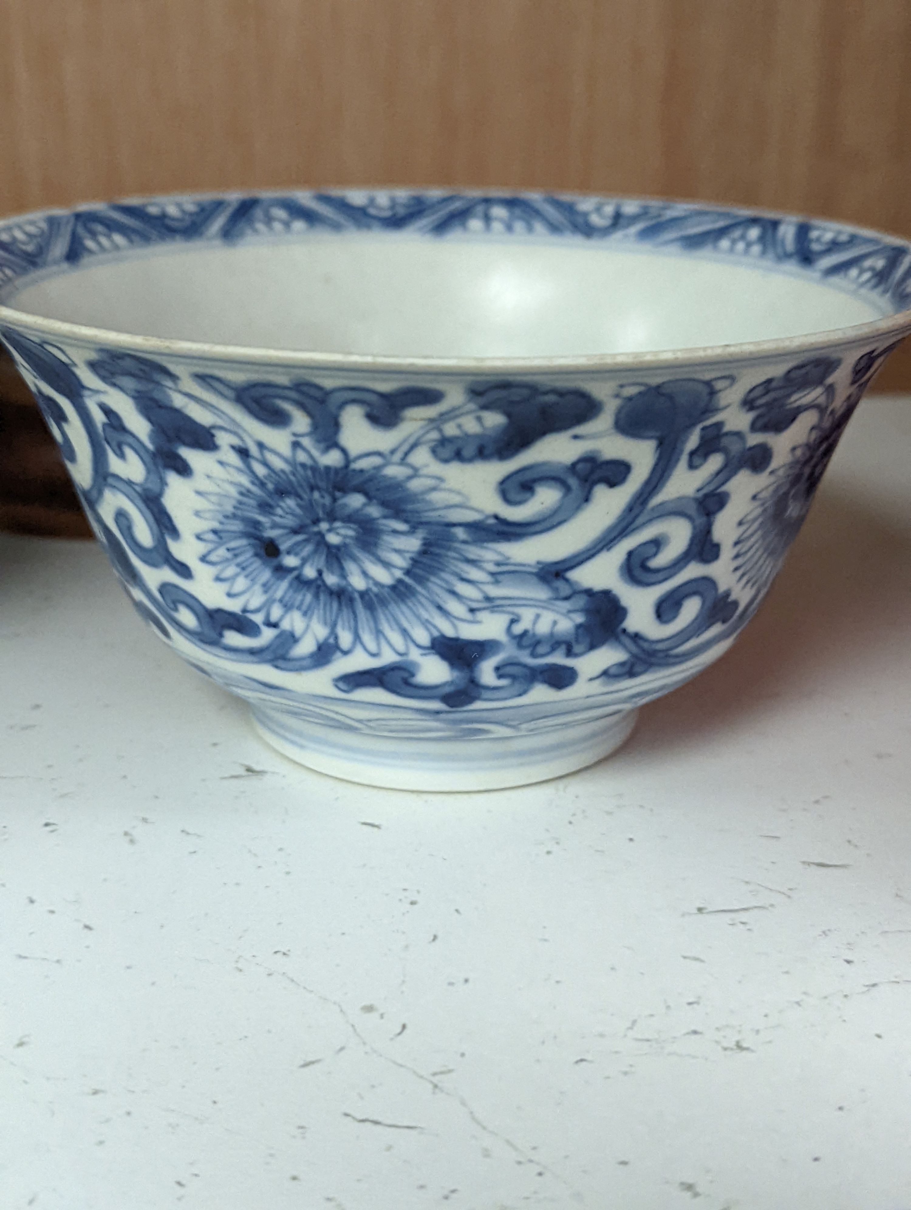 A Chinese blue and white bowl, Kangxi, 15cm. diam., a famille rose teapot stand, Yongzheng, and two doucai bowls